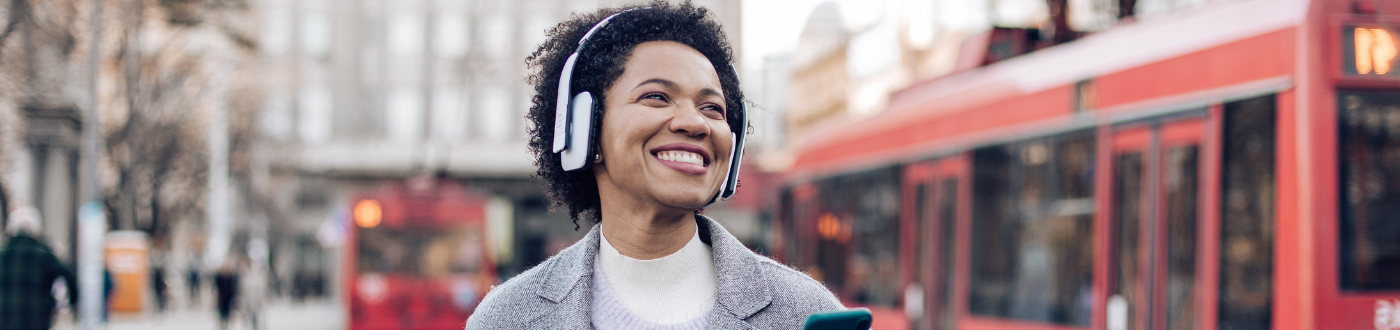 Happy Person Walking with Headphones